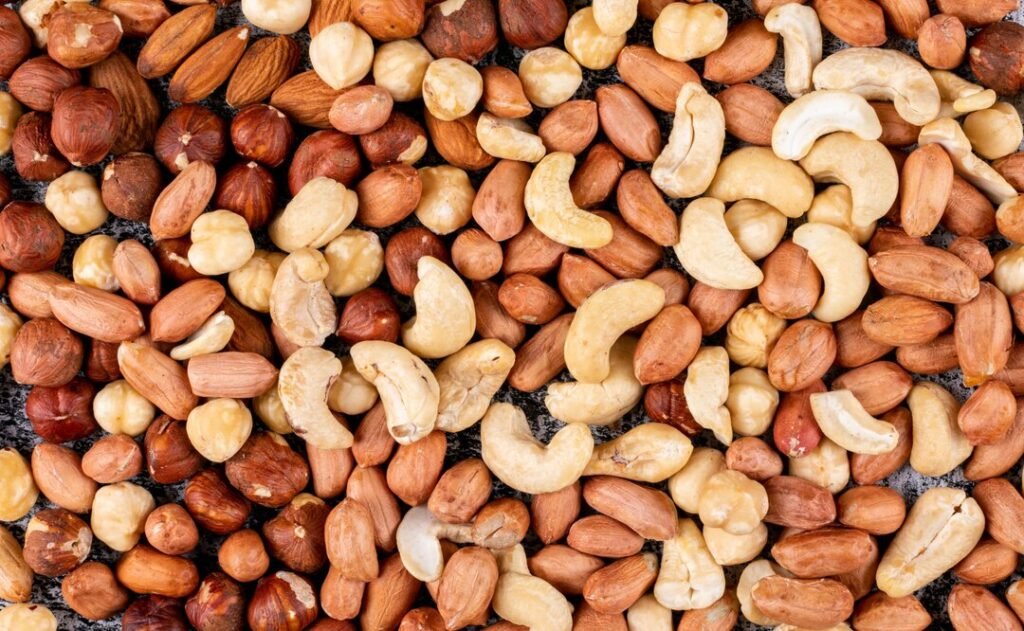 some-different-nuts-with-pecan-pistachios-almond-peanut-cashew-pine-nuts-close-up_176474-2071